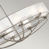 A close-up of the Saldana 8 Light Oval Chandelier - Silver reveals its modern circular frame with frosted glass shades. The sleek metal design is both contemporary and celestial-inspired, beautifully showcasing multiple light fixtures arranged in a circle.