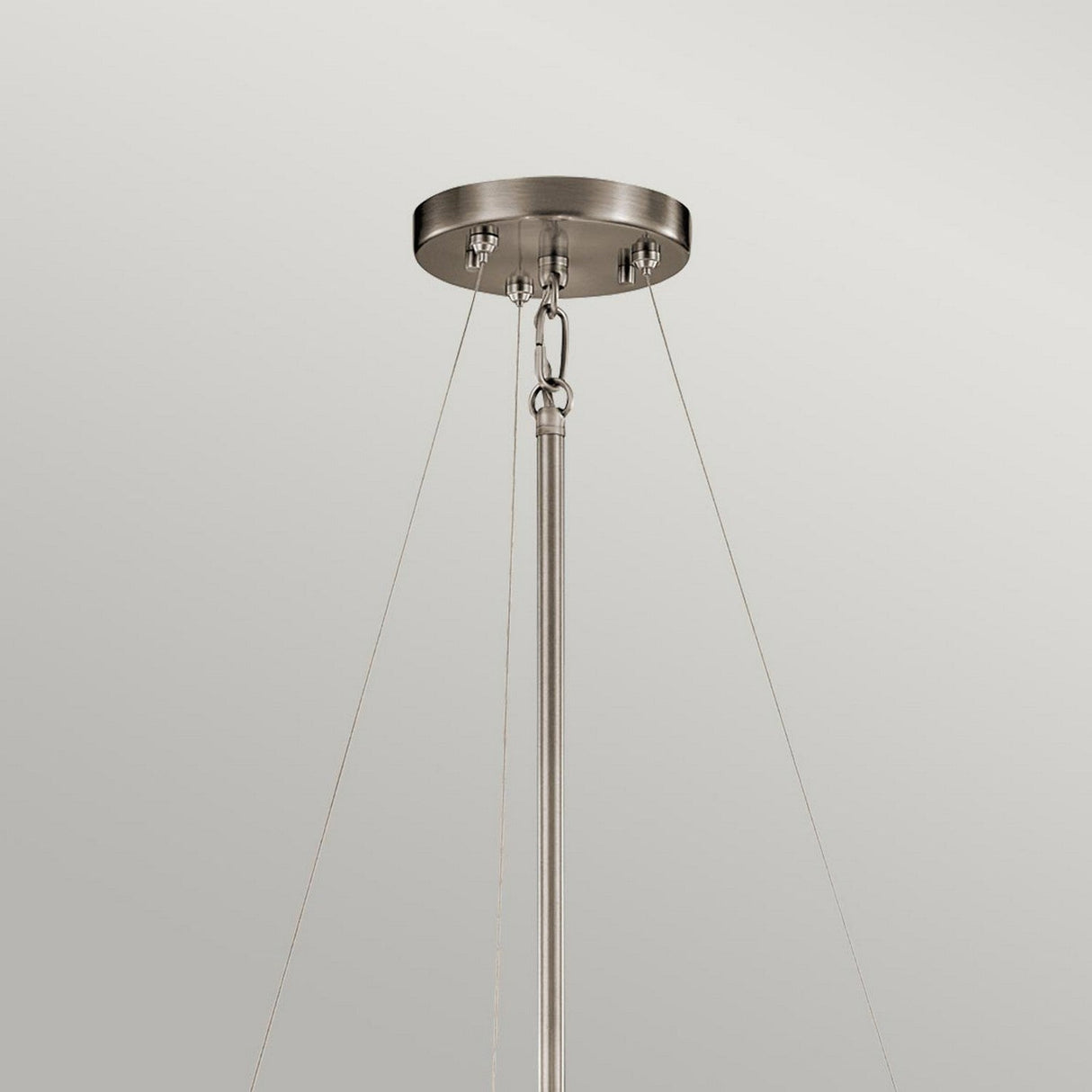 A modern lighting fixture showcasing the Silver Coral 3 Light Pendant/Semi-Flush in silver, featuring a circular base with brushed textured metalwork mounted on the ceiling. It is gracefully suspended by three slender cables and a central rod against a simple light gray background.