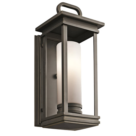 South Hope Outdoor Wall Lantern - A medium-sized light featuring a rubbed bronze rectangular frame and an opal glass cylinder at its center, perfect for illuminating exterior spaces.