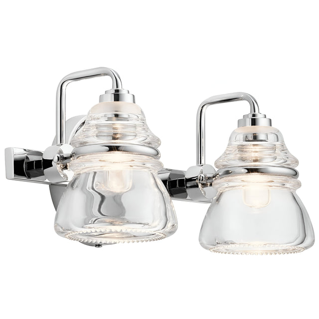 Introducing the Talland 2 Light Wall Light in Polished Chrome, featuring a modern design with two vintage-inspired glasswork shades. This sleek metal fixture and clear glass elegantly display the light bulbs within, offering a contemporary aesthetic that complements various interior styles.