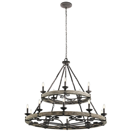 The Taulbee 15 Light Chandelier, featuring a weathered zinc finish, hangs from the ceiling with twelve candle-like lights beautifully displayed around two circular metal frames. These are linked by metal rods and chains, capturing an industrial and vintage aesthetic.