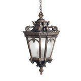 The Tournai Outdoor 4 Light Grand Extra Large Chain Pendant in Bronze boasts a vintage design with intricate metalwork and frosted glass panels. Suspended by a chain, this outdoor pendant features a decorative top, ornate details, and a classic, weathered finish that lends timeless elegance to any space.