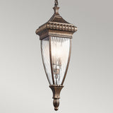 The Venetian Rain Outdoor 2 Light Chain Pendant in Brushed Bronze showcases a vintage-style hanging lantern with intricate brushed bronze details and clear rain glass panels, casting a soft glow. Its classic and elegant design is perfect for enhancing both outdoor and indoor spaces.