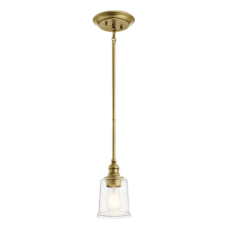 The Waverly 1 Light Mini Pendant - Natural Brass boasts a vintage-inspired design with a clear glass shade and an exposed bulb. Its straight brass rod connects seamlessly to the ceiling mount, creating a perfect blend of classic charm and modern aesthetics.