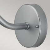 Close-up of a wall-mounted, round, silver stainless steel bracket with a curved arm extending from it against a light gray background. Ideal for the Klampenborg 1 Light Outdoor Wall Light - Silver, with its IP44 rating ensuring durability.