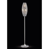 The Kos 4 Light Crystal Floor Lamp features a slender polished chrome stand and a tapered oval lampshade adorned with sparkling crystals, beautifully illuminated against a black background.