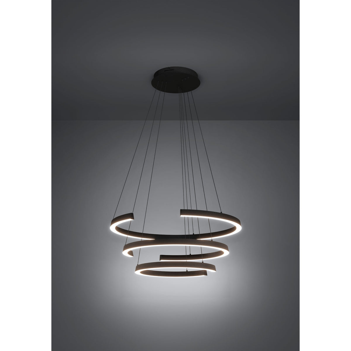 Labonete LED pendant light in black, featuring three tiered spiral rings on fine suspension wires from a round ceiling canopy, dimmable, shown against a plain grey background.