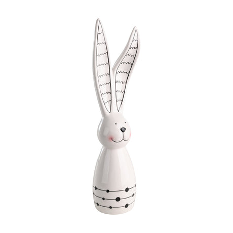 Landjut ceramic rabbit ornament in white and black, tall upright figure with long zigzag-patterned ears, a smiling dotted face and a bell-shaped body with dotted bands, on a plain white background.
