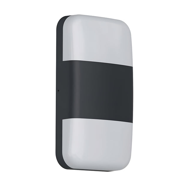 The Lars LED Outdoor Wall Light - Black is a rectangular wall-mounted LED light with rounded edges, featuring a black center stripe that divides two white sections. With an IP65 rating, this light is designed for both indoor and outdoor applications, offering a modern and sleek aesthetic for versatile lighting solutions.