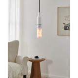 Slim tubular LED bulb, E27 fitting, 3W warm white, opal frosted cover, shown lit in a white pendant fixture above a living room side table.