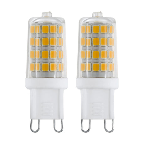 Two LED capsule bulbs with G9 two-pin caps, clear plastic bodies showing visible LED rows, white bases, 3W cool white 320lm, shown on a plain white background.