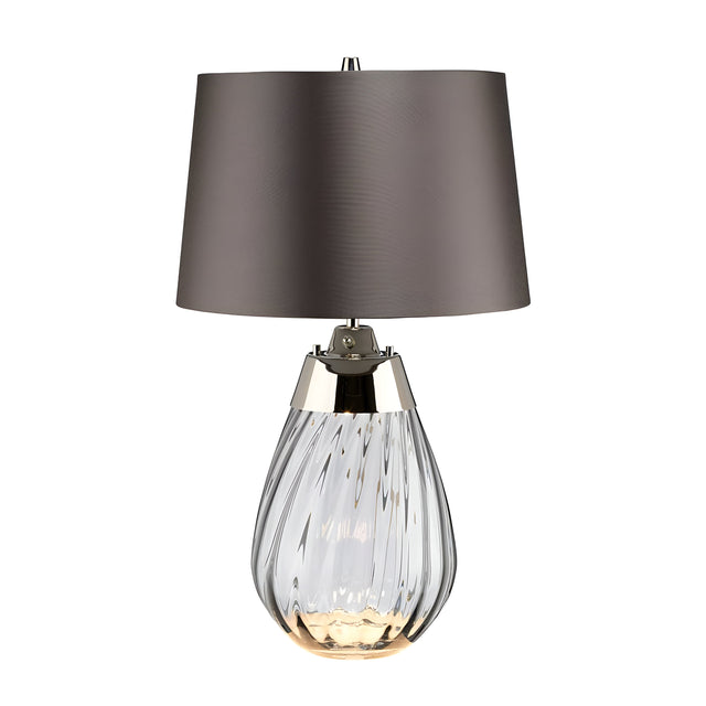 Introducing the Lena 2 Light Small Smoke Table Lamp, featuring a slate shade and a smoke-tinted glass base with elegant swirling patterns. Metallic accents elevate its sophisticated appearance, while the innovative Dual-Lit system provides versatile lighting options.