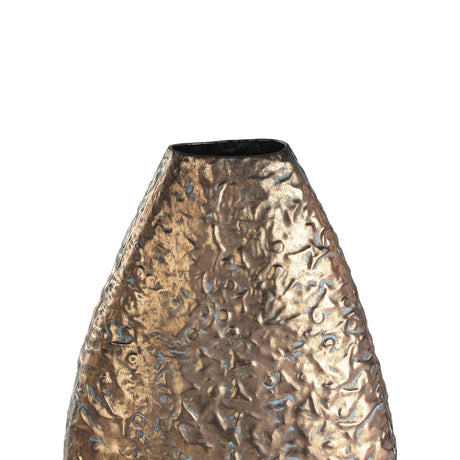 Close-up of the Lenggeng Vase 53.5cm in Antique Gold, showing its tall teardrop shape with hammered, dimpled texture and blue-grey tones in the recesses, set against a plain white background.