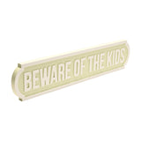 Beware of The Kids Street Sign Plaque, a long rectangular wall art piece with rounded stepped ends, pale green face, raised white border and bold white lettering, shown on a plain white background.