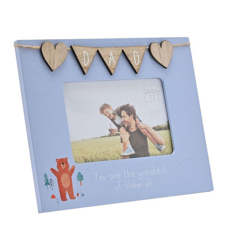 Blue wooden 6x4in photo frame with "DAD" heart bunting across the top, an orange waving bear motif, and "You are the greatest of them all" text, shown with a sample photo on a white background.
