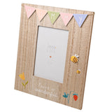 Wooden 6 x 4in photo frame with pastel bunting spelling MUMMY, bee, tulip and strawberry details, and "You're so wonderful" text on brown woodgrain.