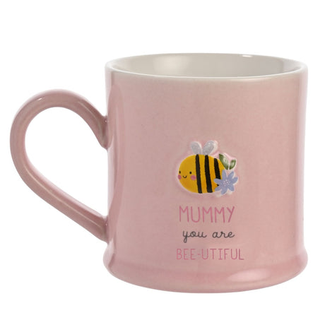 Pink stoneware mug with white interior, featuring an embossed bee and flower design and "Mummy you are Bee-utiful" text, shown on a plain white background.