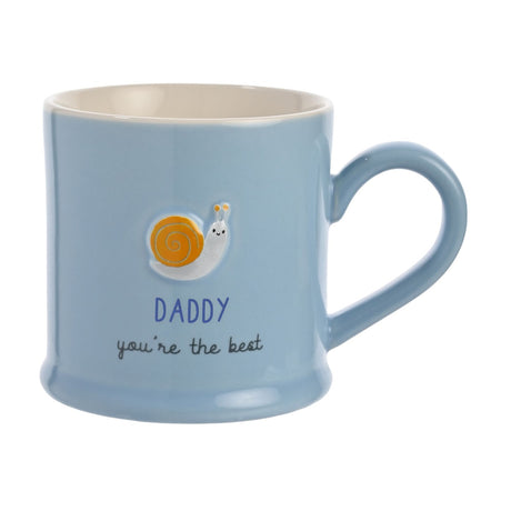 Pale blue stoneware mug with an embossed orange-and-white snail above "DADDY you're the best" text, cream interior, on a white background.