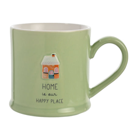Green glazed stoneware mug with a raised house design and "HOME is our HAPPY PLACE" text, set against a plain white background.
