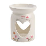 White ceramic wax melt burner with a wide top dish and heart cutout, printed "MUM, you are blooming lovely" with a pink butterfly and floral details, on a plain background.