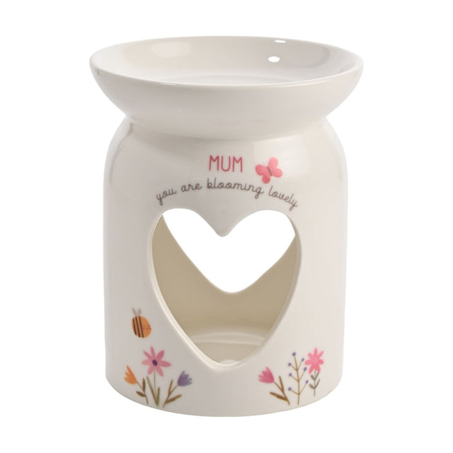 White ceramic wax melt burner with a wide top dish and heart cutout, printed "MUM, you are blooming lovely" with a pink butterfly and floral details, on a plain background.