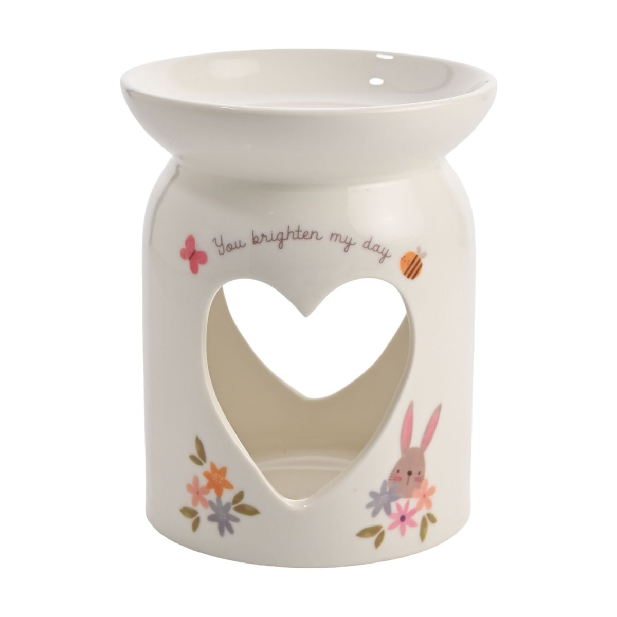 White ceramic wax melt burner with a heart cut-out, "You brighten my day" script, butterfly, bee, bunny and floral details, on a plain background.
