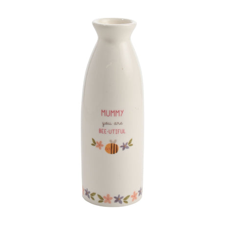 White ceramic stem vase with narrow neck, printed "Mummy you are Bee-Utiful" text, a smiling bee, and pink and purple floral accents on a plain background.