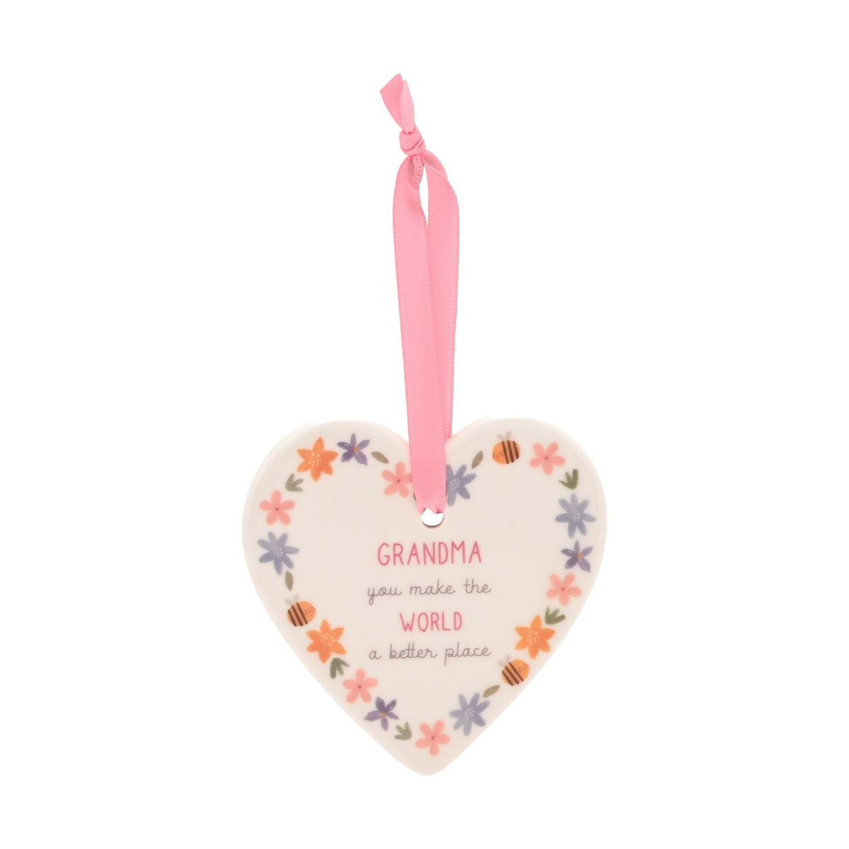 White ceramic heart hanging decoration with floral border and "Grandma, you make the world a better place" text, pink ribbon, plain background.