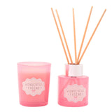 Pink Wonderful Friend mini candle and reed diffuser set with a tumbler candle pot and round diffuser bottle holding pale reeds, both featuring scalloped gift tags, on a white background.
