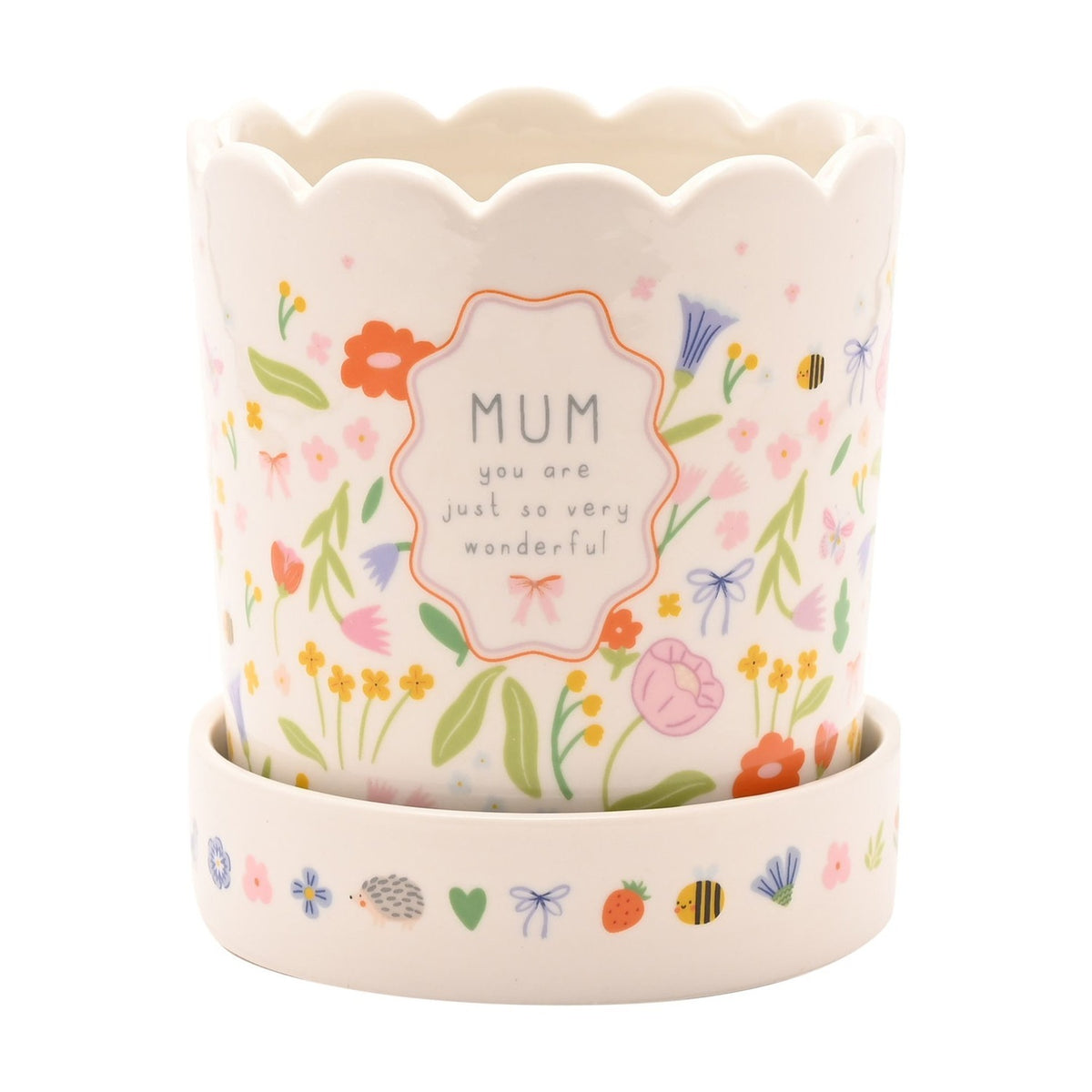 Off-white stoneware planter with scalloped rim and matching saucer, featuring a wildflower, bee and butterfly print and a framed MUM you are just so very wonderful panel.