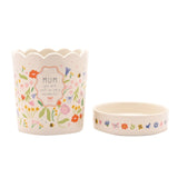 Off-white stoneware planter with scalloped rim and matching saucer, decorated with floral, bee and butterfly prints and a "MUM you are just so very wonderful" panel, shown on a white background.