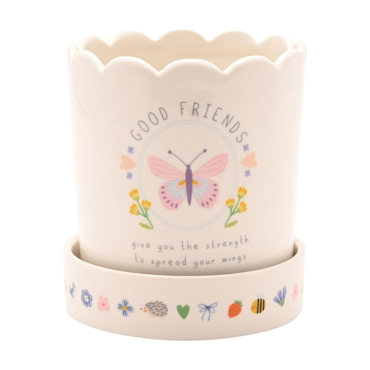 Off-white round stoneware planter with scalloped rim, Good Friends text, butterfly, flower and heart decals, matching saucer with small animal and floral motifs, white background.