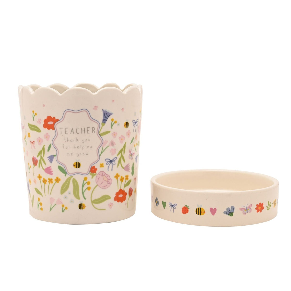 White stoneware planter with scalloped rim and matching saucer, floral meadow print with bees and "TEACHER thank you for helping me grow" text, on a plain background.