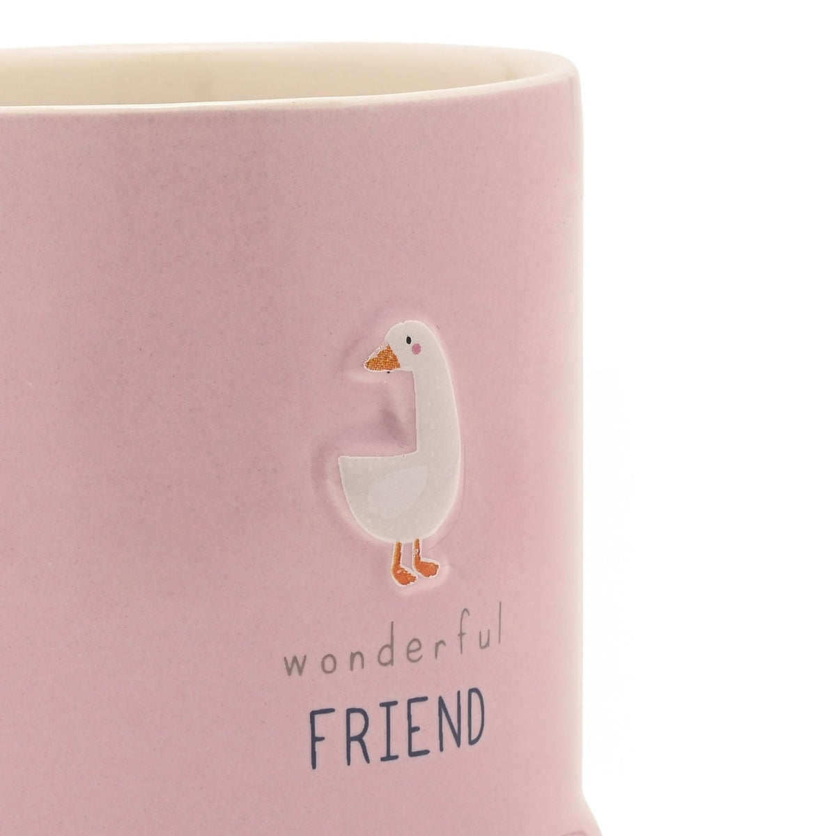 Close-up of a pink stoneware mug with an embossed white goose, orange beak and feet, and the printed text "wonderful FRIEND" below it.