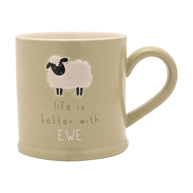 Green stoneware mug with an embossed cream sheep design and the text "life is better with EWE" in grey and white lettering, on a plain white background.