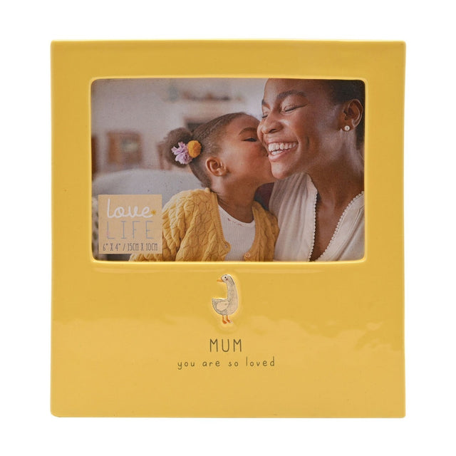 Yellow glazed stoneware photo frame holding a 6 x 4in landscape photo, with a raised goose detail and "MUM you are so loved" text below the window.