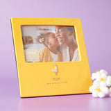 Yellow glazed stoneware photo frame holding a 6 x 4in landscape photo of a mother and child, with a raised goose detail and "MUM you are so loved" text below, shown against a lilac background.