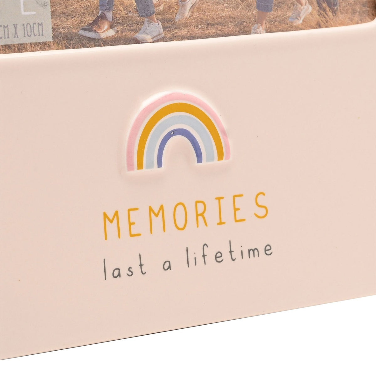 Close-up of the Rainbow Memories glazed stoneware photo frame in cream, showing a raised pastel rainbow and "MEMORIES last a lifetime" text below the 6 x 4in photo window.