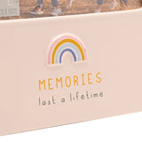 Close-up of the Rainbow Memories glazed stoneware photo frame in cream, showing a raised pastel rainbow and "MEMORIES last a lifetime" text below the 6 x 4in photo window.
