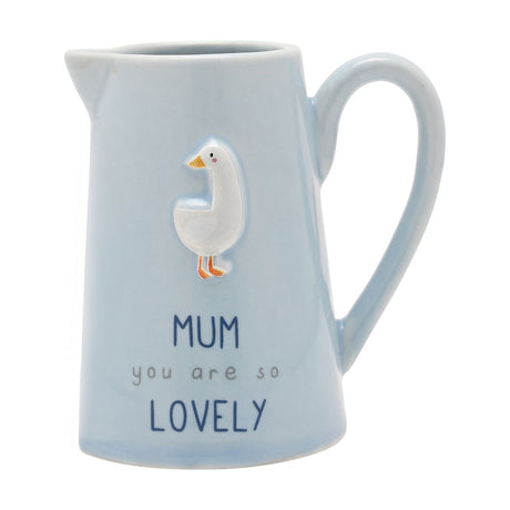 Blue stoneware jug with curved handle and spout, featuring a raised white goose with orange beak and feet above "MUM you are so LOVELY" text, on a plain white background.