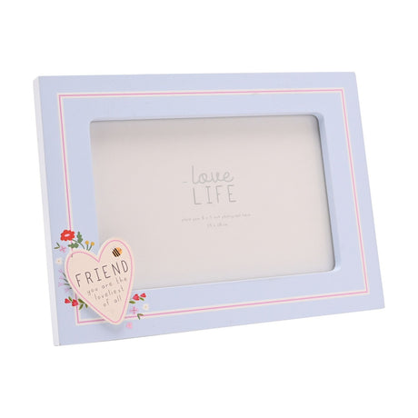 Blue wooden rectangular photo frame with a cream "FRIEND" heart and floral accents in one corner, shown at an angle on a white background.