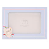 Blue wooden rectangular photo frame with pink double-line border and a cream heart reading "FRIEND you are the loveliest of all," decorated with a bee and red, pink and lilac flowers.
