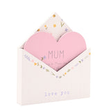 White wooden envelope-shaped plaque with a pink heart insert reading "MUM," floral border detail, and "love you" text on the front, shown on a plain white background.