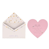 White wooden envelope plaque with floral border and "love you" text, paired with a pink heart insert reading "MUM, being a Mum isn't a big thing it's a MILLION little things", on a plain background.