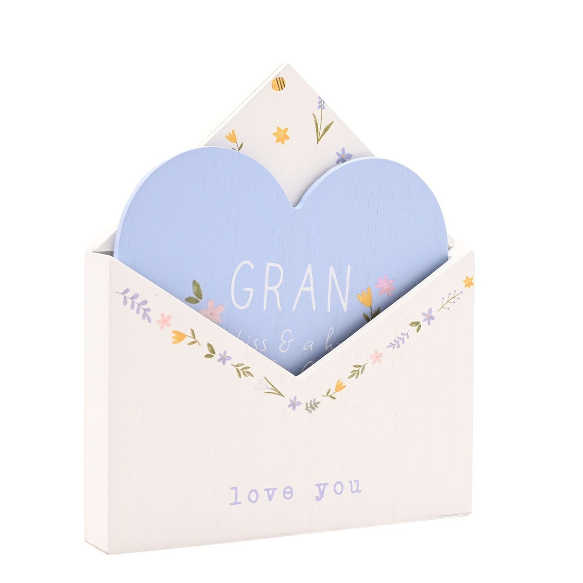 White wooden envelope plaque with a pale blue heart insert reading "GRAN," floral details in pink, yellow and lilac, and "love you" text below, shown on a plain white background.