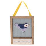 Wooden mini plaque with yellow ribbon, featuring a raised lilac and navy bird on a weathered blue panel, reading "You Are So Lovely" on a white background.