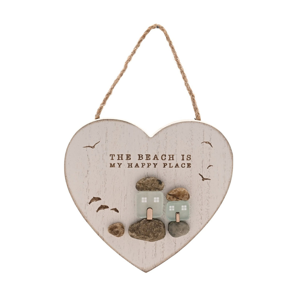 White heart-shaped wall plaque with jute cord, reading THE BEACH IS MY HAPPY PLACE above frosted sea glass cottages on pebble bases with gulls in flight, white background.