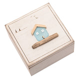 Square Sea Glass House Trinket Box with hinged lid in white, featuring a pale blue glass house with wooden roof on the lid, engraved birds and trees, on a plain white background.