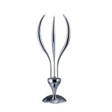 The Llamas 3 Light Table Lamp - Polished Chrome features three sleek, curved prongs rising from a rounded base, creating a modern sculptural look ideal for contemporary spaces.