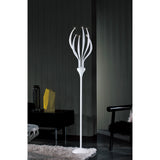 The Llamas 6 Light Floor Lamp in gloss white features multiple curved arms with small lights, standing in a dim room with dark walls, a shaggy rug, black chair, and geometric decor on the side table.